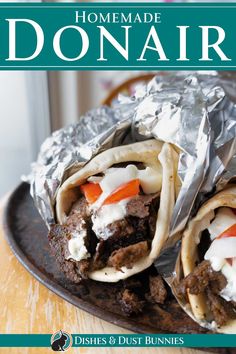 the cover of homemade donair with meat and vegetables wrapped in foil on a plate