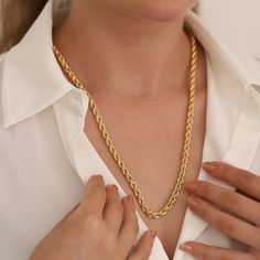 "With the 14k Gold 5mm Rope Chain Necklace, you can enter the realm of timeless beauty. This jewelry piece, a combination of classic elegance and contemporary refinement, crosses decades to provide a timeless accessory for everybody.  The exquisite twist of the rope chain, steeped in symbolism, is meticulously made from 14k gold, displaying not only visual attraction but also unsurpassed quality. The necklace's unisex design seamlessly compliments many styles, giving a touch of refinement to any appearance.  This necklace becomes a canvas for personalized expression, with a choice of six widths, giving a precise fit that fits with personal tastes. The 14k Gold 5mm Rope Chain Necklace exemplifies the enduring grace of vintage-inspired design blended with modern elegance, whether celebrating Elegant Tarnish Resistant Rope Chain Necklace Gift, Classic Rope Chain Link Necklace For Gift, Classic Gold Rope Chain Necklace Gift, Elegant Rope Chain Link Necklace As Gift, Elegant Rope Chain Necklace For Anniversary, Elegant Anniversary Rope Chain Necklace, Classic Rope Chain Necklace For Anniversary, Twisted Chain, Gold Chain Design