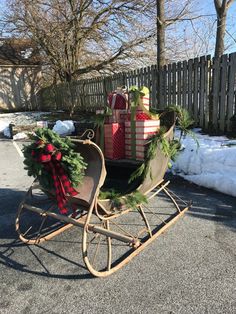 a wooden sleigh with presents on it