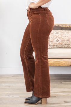 Product Details Wash/Color: Cognac Rise: Mid Rise Style: Corduroy Bootcut Material and Care: 97% Cotton 3% Spandex Machine Wash Cold Tumble Dry Low Size and Fit 24=0 Rise: 8.5" Inseam: 32" 25=1 Rise: 9" Inseam: 32" 26=3 Rise: 9" Inseam: 32" 27=5 Rise: 9" Inseam: 32" 28=7 Rise: 9.5" Inseam: 32" 29=9 Rise: 9.5" Inseam: 32" 30=11 Rise: 10" Inseam: 32" 31=13 Rise: 10.5" Inseam: 32" 32=15 Rise: 10.5" Inseam: 32" Photo model is 5'7 and wearing a size 25 Photo model is 5'7 and wearing a size 27 Video m Corduroy Bootcut Pants, Bootcut Pants, Photo Model, Swimsuit Shops, Long Sleeve Cardigan, Long Cardigan, Dress Romper, Floral Print Dress, Long Sleeve Maxi Dress