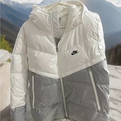 Nwot The Jacket Has Several Features Including Zipped Pockets, A Lightweight Bodywarmer, Padded Insulation, Thermal Soft Shell, And Full Zip Closure. The Jacket Is Perfect For Outdoor Activities Such As Walking, Hunting, Hiking, Hockey, And Basketball. It's A Stylish Addition To Your Winter, Fall, And Spring Wardrobe. White Reflective Winter Outerwear, Winter White Outerwear With Reflective Details, White Windbreaker With Reflective Details For Streetwear, White Technical Windbreaker For Streetwear, Technical White Windbreaker For Streetwear, Sporty Nylon Puffer Jacket For Outdoor Activities, White Streetwear Windbreaker With Reflective Details, Winter Technical Track Jacket With Reflective Details, White Sports Windbreaker With Reflective Details