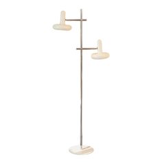 the three light floor lamp has two white lamps on each pole and one is turned off