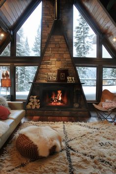 a living room filled with furniture and a fire place in the middle of a room