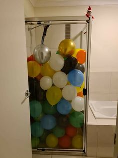 the balloons are in the shower stall and ready to be picked up