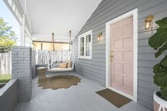 the front porch is clean and ready to be used as a living room or bedroom