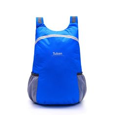 a blue backpack sitting on top of a white floor with the word urban printed on it