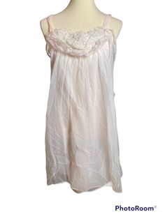 "50s Vintage Pink and White Flowy Nightgown with Front Embellishment.  Brand: Simonella et Fabiano Size: L Material: 100% Nylon Condition: Fine. There is a rip on the side as seen in pictures. One of the straps is safety pinned. Also seen in photos.  Measurements: Length- 34.5\" Bust- 34\" Waist- 36\" Hips- 36\"" Flowy Nightgown, Vintage Pink Nightgown For Spring, Pink V-neck Nightgown For Lounging, Pink Casual V-neck Nightgown, Pink V-neck Nightgown With Lace Trim, Vintage Pink V-neck Nightgown, Women's Nightgowns, 50s Vintage, Nightgowns