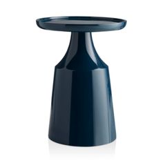 a small blue table with a black top on it's legs and an upside down design