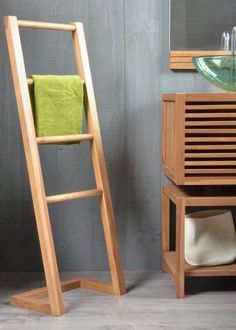 a wooden ladder next to a sink in a bathroom