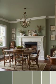 a dining room with green walls and furniture