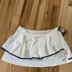 Super Cute White Nike Tennis Skirt, Brand New With Tags Never Worn. No Stains Hoes Or Pilling, Just Sadly Too Big For Me, Got It On Sale Thinking It Would Eventually Fit Me But Sadly Still Is Too Big And Getting Tired Of Holding On To It. Please Let Me Know If You Have Any Questions At All, I Am Here To Help:) White Cotton Skirted Skort, Nike White Tennis Skirt For Spring, Nike White Fitted Tennis Skirt, Fitted White Nike Tennis Skirt, Nike White Skort For Spring, Fitted White Nike Skirt, Nike White Lined Skirt, Nike White Summer Skirt, Nike White Skirt For Summer