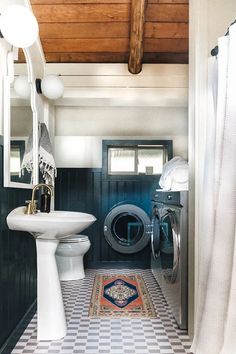 a washer and dryer in a small bathroom