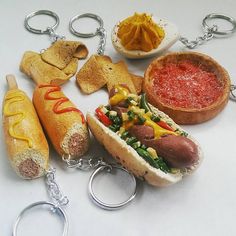 a hot dog keychain is shown with other food items