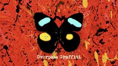 a black butterfly with yellow eyes on a red background that says, overpass graffiti