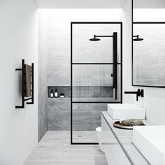 a white bathroom with two sinks and a walk - in shower next to a toilet