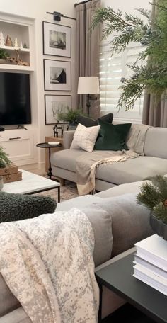 a living room filled with furniture and a flat screen tv