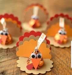 turkey place cards are sitting on a table with little tags in the shape of turkeys