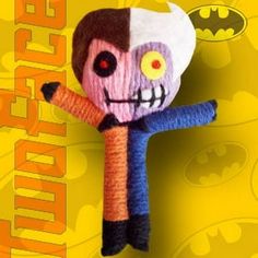 a knitted doll with a bat on it's head and hands in the shape of a skeleton