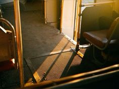 an empty bus seat with the door open