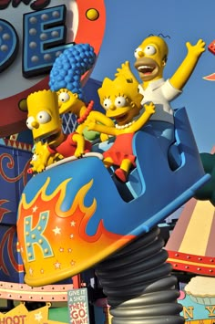 the simpsons characters are riding on a roller coaster