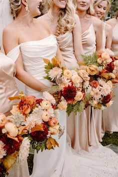 the bride and her bridesmaids are holding bouquets