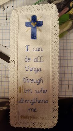 a cross stitch bookmark with the words i can be all things through him