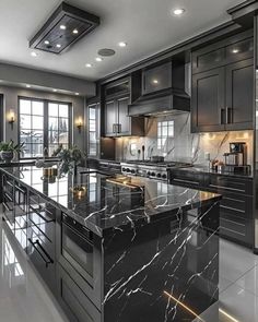 a large kitchen with marble counter tops and black cabinets, along with stainless steel appliances