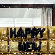 a large balloon sign that says happy new year