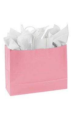 a pink shopping bag filled with white tissue paper