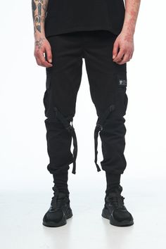 Black mens cargo pants /drop crotch trousers /hip hop pants. If u like urban or streetwear style, you will like this cargo. International Size: S, M, L, XL Material: 100% Cotton Black color Pockets: 6 pcs. Style: Urban  Fit: skinny + cuffs 10 cm Season: Spring / Summer / Autumn SIZE: We use the international dimensional grid to determine the size. But we prefer to sew clothes for each specific customer by his individual measurements. You provide us with your measurements, and we sew clothes specially for you. MEASUREMENTS Please write your height and weight so we can choose the correct size. DELIVERY: All the items are made to order, only for you. It usually takes 1-14 days to make any item. After the items are ready we ship it from our local post office - https://ukrposhta.ua/. It takes 7 Tactical Bottoms With Multiple Pockets For Streetwear, Combat Style Cargo Pants With Belt Loops For Streetwear, Urban Cargo Pants With Belt Loops For Streetwear, Tactical Streetwear Pants With Pockets, Techwear Streetwear Pants With Cargo Pockets, Black Tactical Pants For Streetwear, Black Tactical Bottoms For Streetwear, Urban Streetwear Joggers, Techwear Pants With Cargo Pockets For Streetwear