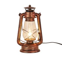 an old fashioned lantern with a light on it