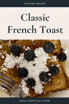 french toast topped with blueberries and powdered sugar on a white plate next to a fork