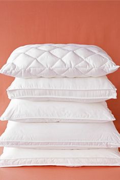 four pillows stacked on top of each other