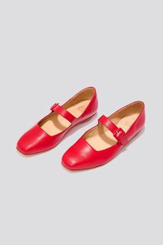 The Eugenia Flat is a modern interpretation of the classic mary jane flat featuring a square toe, angular topline and oval-shaped heel. This pair is crafted from vibrant cherry red kidskin leather and a matching buckle. Who it’s for: The woman who is looking for mood-enhancing emotional pieces that defy reason, yet work perfectly with her style and sense of expression. Kidskin upper and undyed vegetable-tanned leather lining. Leather sole with stacked leather heel measuring 18mm. Handmade in Arg Red Mary Janes For Spring Formal Occasions, Red Mary Janes For Spring Formal Events, Red Mary Janes With Buckle Closure For Spring, Red Leather Closed Toe Ballet Flats, Classic Red Ballet Flats With Leather Sole, Classic Red Ballet Flats, Classic Red Closed Toe Ballet Flats, Red Closed Toe Mary Janes With Buckle Closure, Formal Red Leather Mary Janes