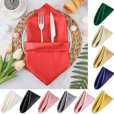 napkins with forks and spoons in different colors on top of a table next to flowers