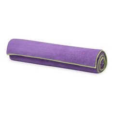 purple yoga mat rolled up on white background