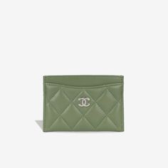 The classic mini card holder from Chanel is the ideal luxurious accessory to add into any of your handbags. Featuring several slots for use of cards, this holder will keep everything secure and safe. SPL Exterior Olive green lambskin leather Silver hardware Four card slots Unused condition Serial code 31XXXXXX - Year of Production 2021 Sold with dustbag and card only SPL Height 7cm Width 11cm Depth 0.5cm Chanel Card Holder, Card Holder Purse, Classic Card, Cross Bag, New Green, Timeless Handbag, Wallet Accessories, Classic Mini, Leather Silver