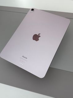 an apple ipad sitting on top of a table