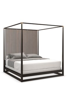 a bed with a metal frame and mattress on it's side, in front of a white background