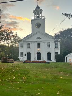 a large white church with a clock tower