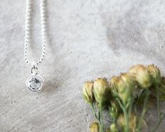 A perfectly delicate CZ solitare necklace with tiny little cz diamond. Elegant yet minimalist necklace! This dainty silver necklace is made with sterling silver chain and a sterling silver solitaire bezel with CZ diamond 5mm. Measures 15.6 in. + 2,5 in extension chain You can select: - Cz colour: violet amethyst (February), clear (April), green peridot (August), champagne citrine (November) - Style chain: rolo chain or ball chain. About Cz Diamond: Cubic zirconia is a fantastic simulated diamond Silver Solitaire Round Pendant Necklace For Everyday, Delicate Silver Solitaire Necklace For Everyday, Everyday Delicate Silver Solitaire Necklace, Minimalist Silver Birthstone Necklace For Everyday, Everyday Minimalist Silver Birthstone Necklace, Silver Delicate Birthstone Necklace For Everyday, Delicate Silver Birthstone Necklace For Everyday, Everyday Silver Solitaire Necklace, Everyday Sterling Silver Solitaire Necklace