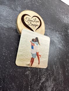 a coaster with an image of two people hugging