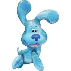 an inflatable blue dog toy sitting on the ground