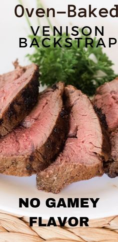 there is a plate with meat on it and the words oven baked venison backstrap