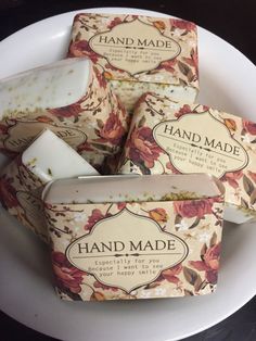 four soap bars sitting on top of a white plate