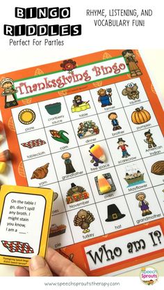 a person is holding up a thanksgiving themed game with words and pictures on the front