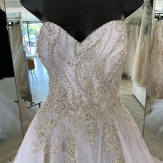 a wedding dress on display in a store