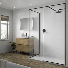 a bathroom with a sink, mirror and shower stall in the middle of the room