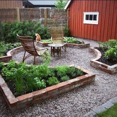 an outdoor garden area with chairs, tables and plants in the center surrounded by gravel