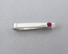 This set makes a great 15th or 40th wedding anniversary gift or a gift for anyone with a birthday in July. They are simple, modern and timeless. The cufflinks are flush set with 2.25mm round genuine rubies. The tie clip is set with a 4mm lab created ruby.Ruby is the birthstone for July and is given on the 15th and 40th anniversaries. Rubies are considered the stone of love, energy, passion, power, and a zest for life. Like no other gemstone in the world, Ruby is the perfect symbol for powerful f Modern Ruby Jewelry For Formal Occasions, Modern Ruby Wedding Jewelry, Red Clip-on Jewelry For Anniversary, Silver Rectangular Cufflinks As Gift, Ruby Cufflinks, 40th Wedding Anniversary Gifts, Classic Clip-on Cufflinks For Gift, Square Sterling Silver Cufflinks, 15th Wedding Anniversary